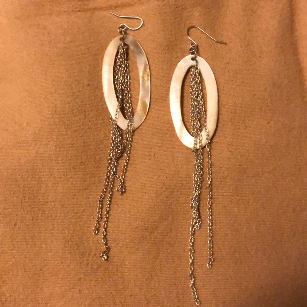 White oval earrings with hanging chains